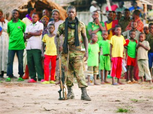 A Seleka fighter stands in a village close to the border of the Democratic Republic of Congo June 10, 2014.  Picture taken June 10, 2014. REUTERS/Goran Tomasevic (CENTRAL AFRICAN REPUBLIC - Tags: CIVIL UNREST POLITICS TPX IMAGES OF THE DAY)