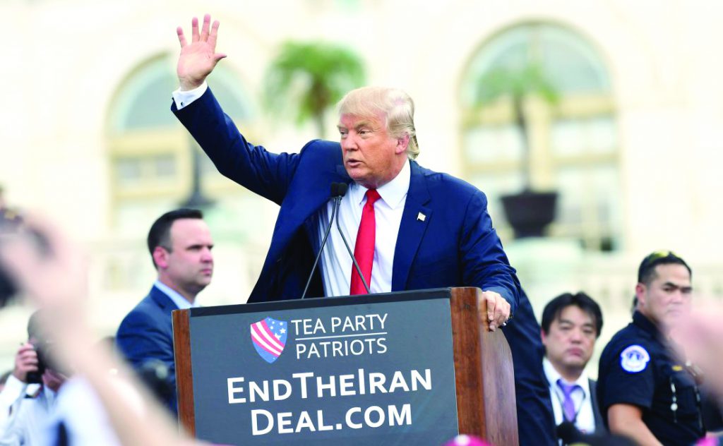 Republican presidential candidate Donald Trump waves to the crowd after speaking during a rally opposing the Iran nuclear deal outside the Capitol in Washington, Wednesday, Sept. 9, 2015. (AP Photo/Susan Walsh)